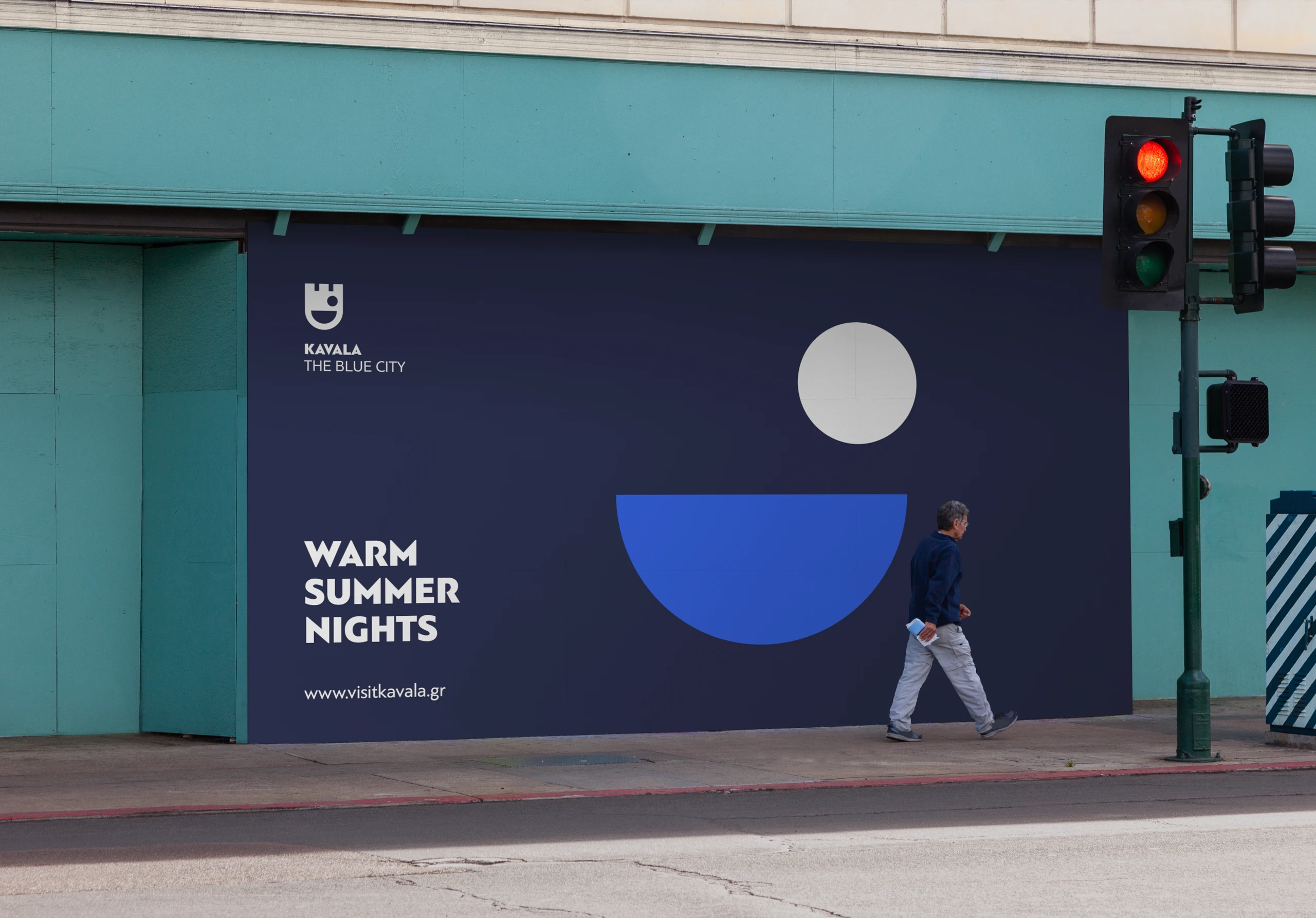 visit kavala – hoarding on a street corner reading “Warm summer nights”